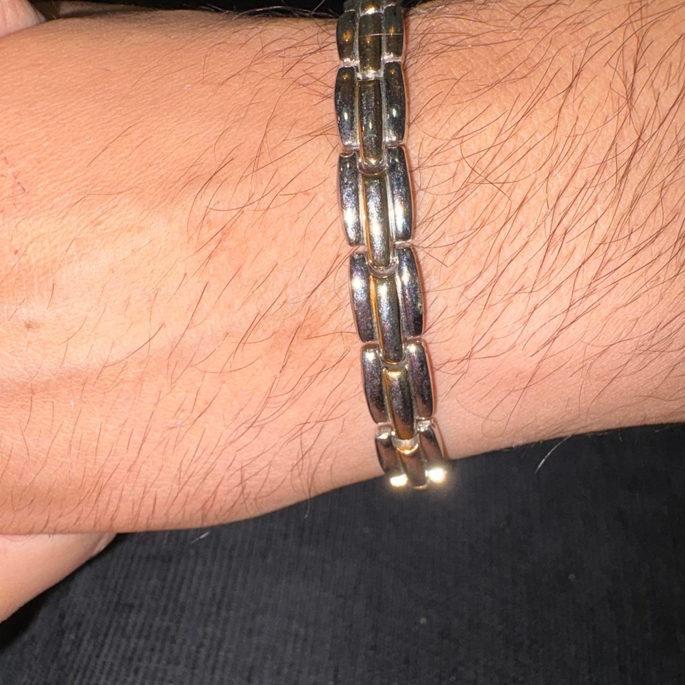 Silver bracelet with gold accents